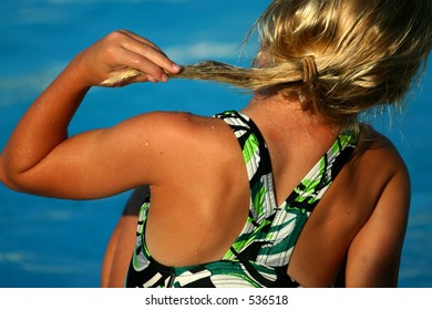 Girl Playing With Hair By Pool