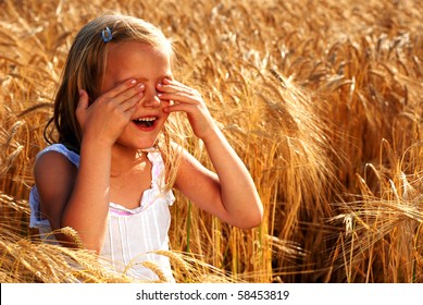 Girl playing hide and seek