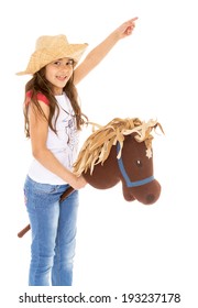 Girl playing with horse and shows to the side