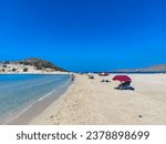 girl playing on the beach of elafonisos, simos beach, greece