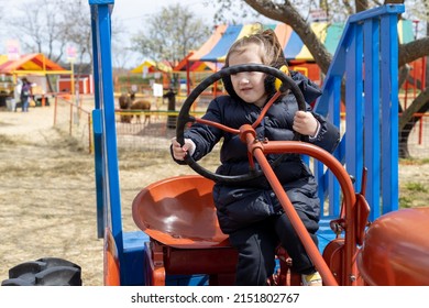 Girl Playing On A Farm. Little Farmer, Truck Driver