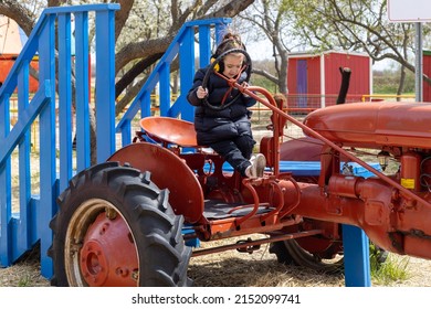 Girl Playing On A Farm. Little Farmer, Truck Driver