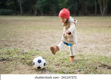 toddler kicking ball