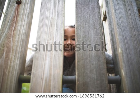 Similar – Image, Stock Photo Little girl climbing to a wooden observation tower in a wetland