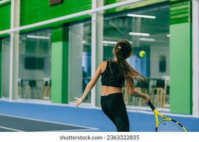 girl playing tennis on the court - Powered by Shutterstock