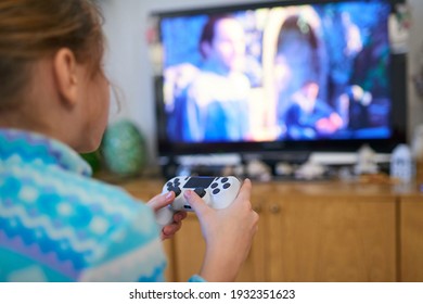 Girl Playing Video Game With Joystick At Home