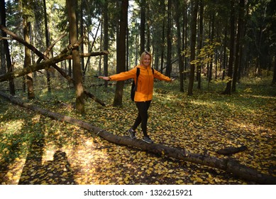 girl playing for a walk in the fall in the woods - Powered by Shutterstock