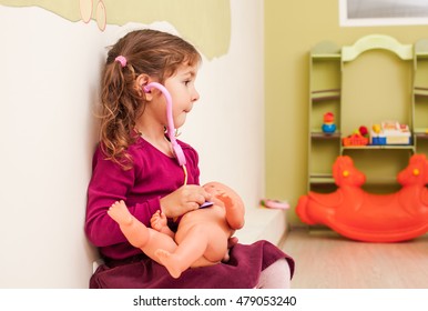 Girl plays the doctor