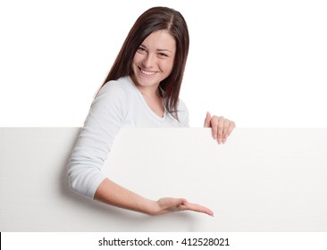 Girl Pointing With Hand On A Huge Blank White Sheet Of Paper