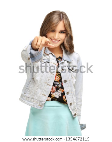 Girl pointing with index finger and laughing