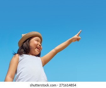 Girl pointing to the sky - Shutterstock ID 271614854