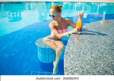 Girl In Pool Bar At Tropical Tourist Resort Vacation Destination