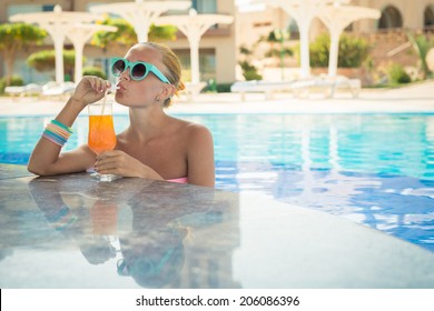 Girl In Pool Bar At Tropical Tourist Resort Vacation Destination