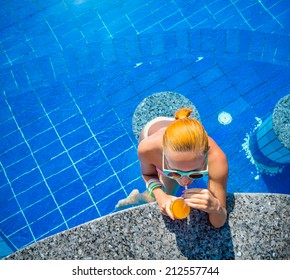 Girl In Pool Bar At Tropical Tourist Resort Vacation Destination