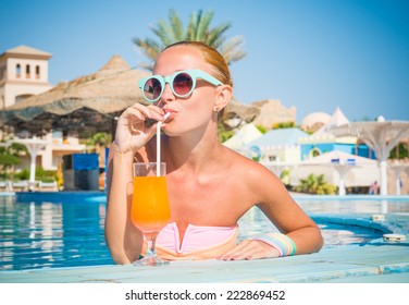 Girl In Pool Bar At Tropical Tourist Resort Vacation Destination