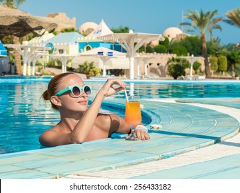 Girl In Pool Bar At Tropical Tourist Resort Vacation Destination