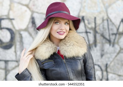 Girl portrait with maroon floppy hat