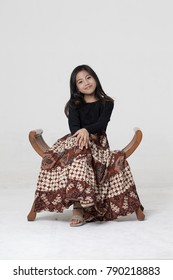 A Girl Pose Wearing Traditional Batik Skirt