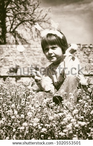 A girl poses on Kalemegdan fortress with butterflies on her head