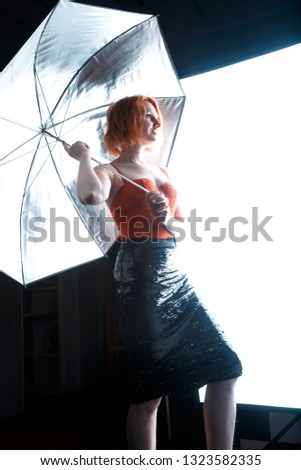 girl posing for the camera in the studio background
