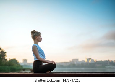 Girl Practice Yoga Early Morning On Pier.