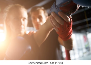 Girl Practicing Boxing With Coach