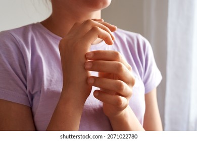 Girl Practicing EFT Tapping Or Emotional Freedom Technique, Indoors