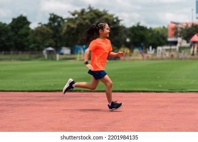 Girl Practicing On Her Running Technique In The Track