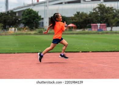 Girl Practicing On Her Running Technique In The Track