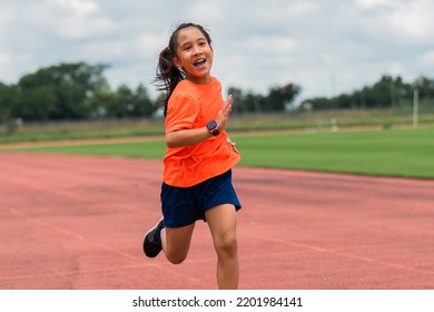 Girl Practicing On Her Running Technique In The Track