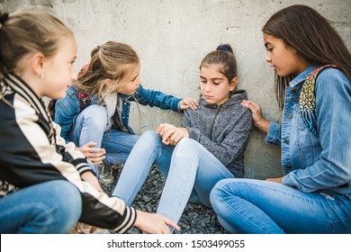 girl problem at school, sitting and consoling child each other