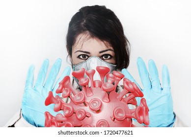 A girl in a protective respiratory mask with sad eyes removes the huge virion of the coronavirus Covid-19 from the face with his hands in medical gloves, close up, isolated on white, 3D rendering - Powered by Shutterstock