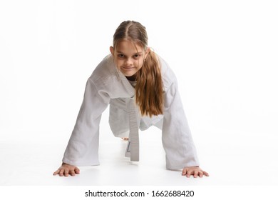 Girl Push-UPS From The Floor In A Sports Keikogi