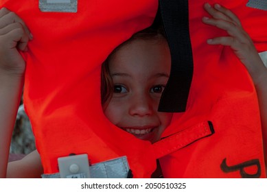 child putting on jacket