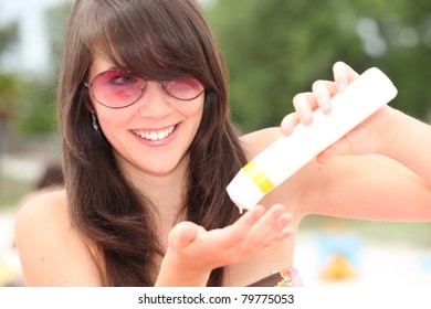 Girl Putting On Suncream