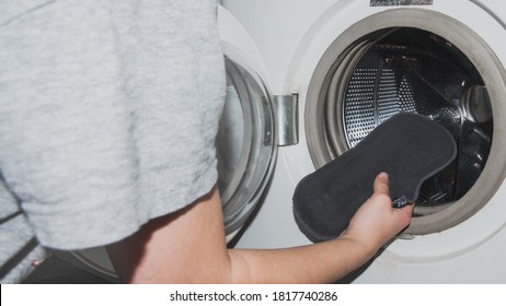 A Girl Putting A Reusable Cloth Menstrual Pad On A Washing Machine