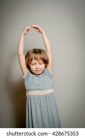 Girl Raises Arms Up