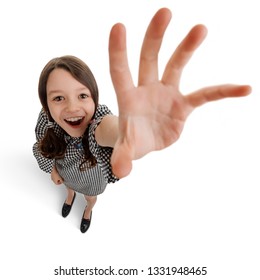 Girl Reaching Out Her Hand. Kid Is Amazed By Something And Trying To Touch It. Funny Fisheye Shot With Big Hand.