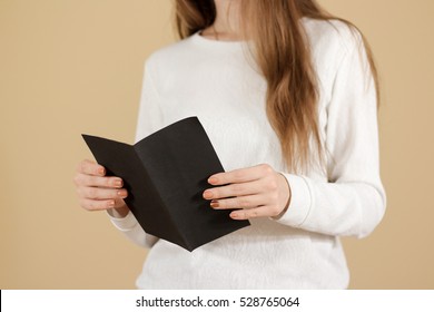 Girl Reading Blank Black Flyer Brochure Booklet. Leaflet Presentation. Pamphlet Hold Hands. Woman Show Clear Offset Paper. Sheet Template. Booklet Design Sheet Display Read First Person.