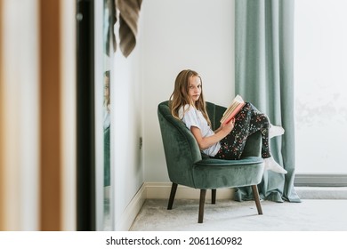 Girl Reading A Book On A Couch, New Normal Hobby