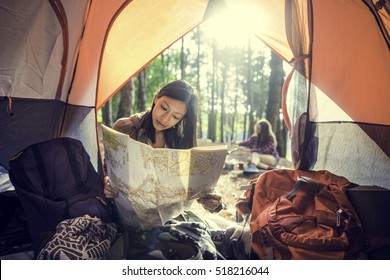 Girl Reading Map Traveling Destination Camping Concept - Powered by Shutterstock