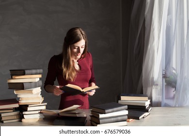 Girl Reads A Lot Of Books At Home