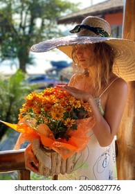 Girl Receiving Flowers In Romantic Enviroment.