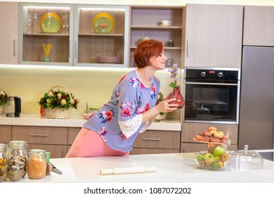 girl with the red hair kitchen and flowers