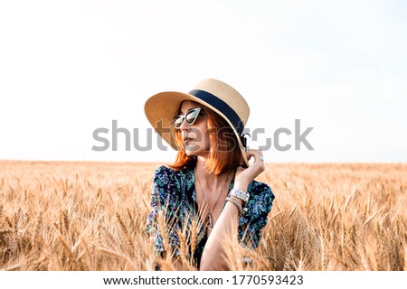 Similar – Image, Stock Photo Happy blonde woman with sunglasses and a hat enjoying the sun in nature