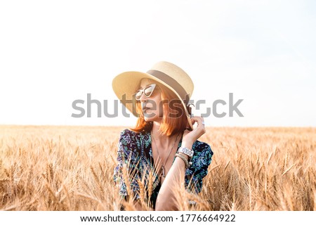 Similar – Image, Stock Photo Happy blonde woman with sunglasses and a hat enjoying the sun in nature