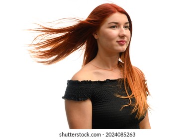 Girl With Red Hair In The Wind In The Studio On White Isolate