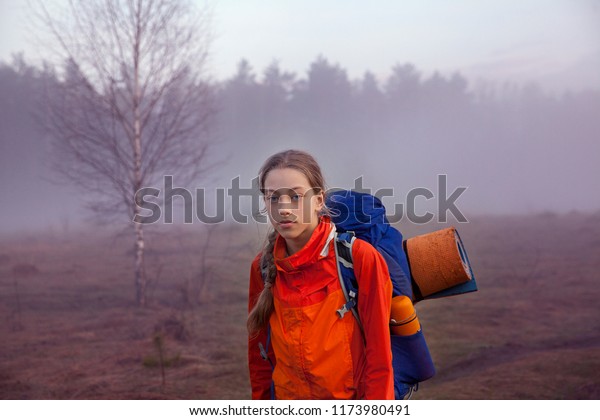 the girl with the blue backpack