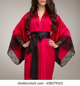 Girl In Red Silk Robe, On Gray Background