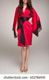 Girl In Red Silk Robe, On Gray Background